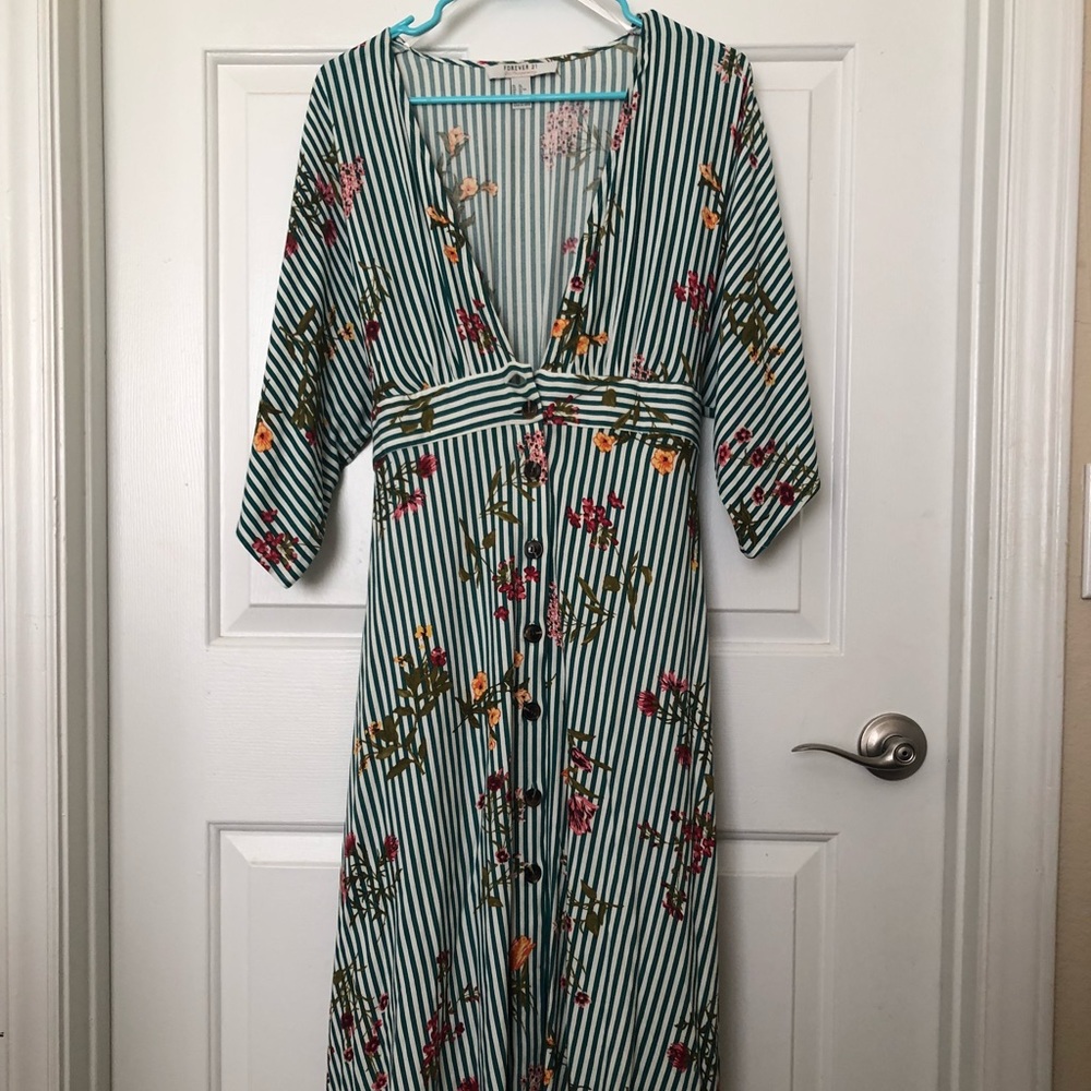 A beautiful knee length dress with a deep v neck.